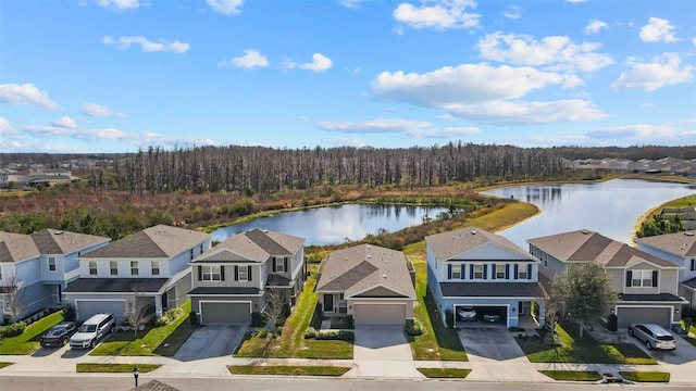 birds eye view of property with a water view