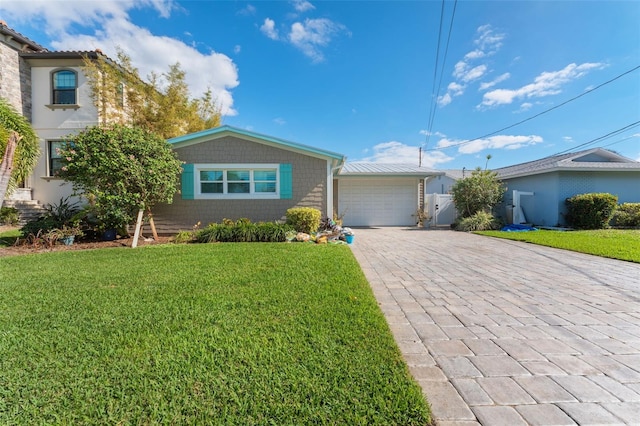 ranch-style home with a garage and a front yard