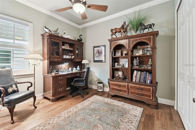 office area featuring wood-type flooring, ornamental molding, and ceiling fan