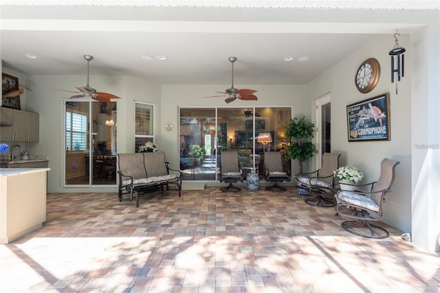 interior space with sink and ceiling fan