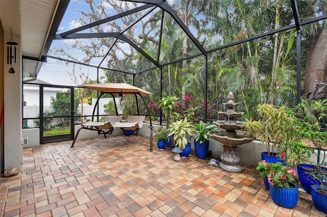 view of patio with glass enclosure