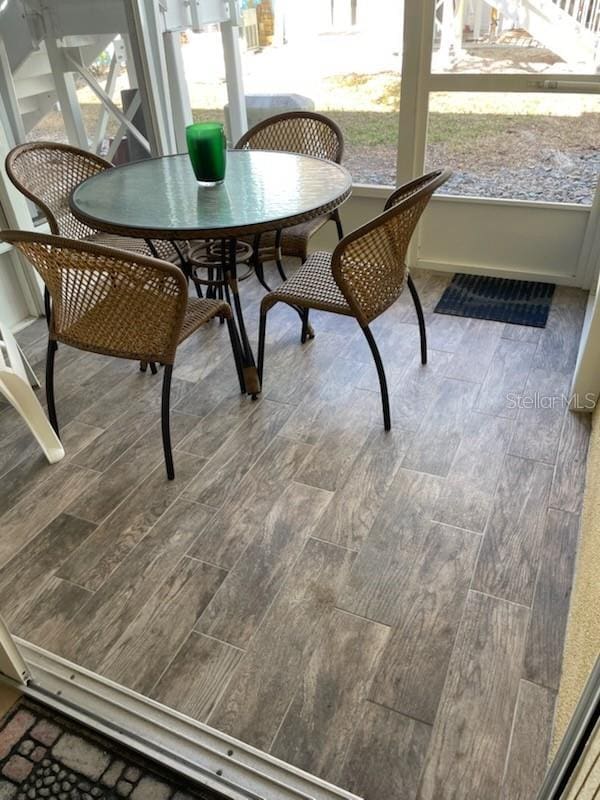 sunroom featuring a healthy amount of sunlight