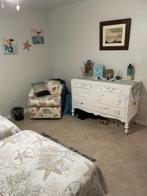 bedroom with light tile patterned floors