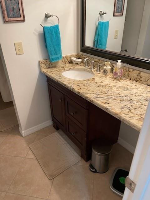 bathroom featuring tile patterned floors and vanity