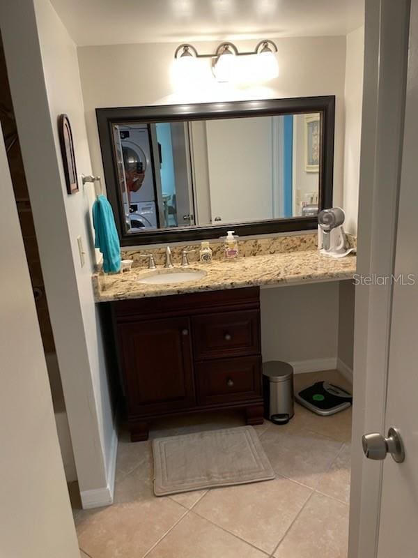 bathroom with tile patterned flooring and vanity