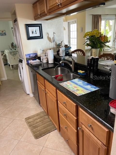 kitchen with a healthy amount of sunlight, sink, and light tile patterned floors