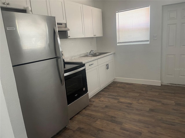 kitchen with white cabinetry, appliances with stainless steel finishes, sink, and dark wood-type flooring