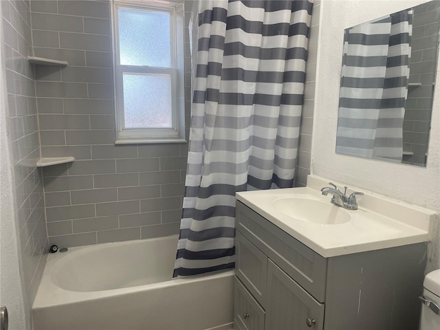 full bathroom featuring shower / bathtub combination with curtain, vanity, and toilet