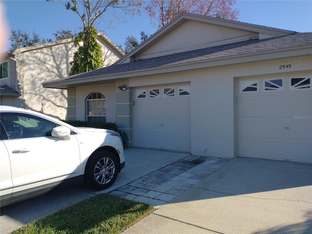 view of side of property featuring a garage