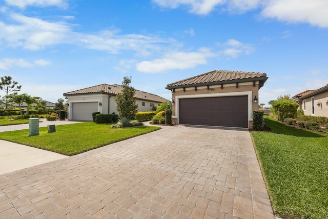 mediterranean / spanish house featuring a front yard