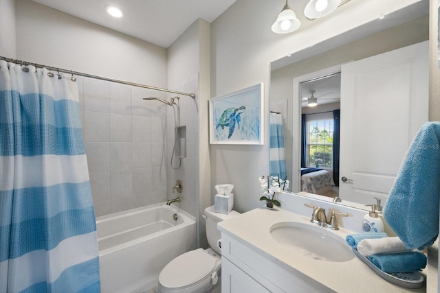 full bathroom featuring shower / bathtub combination with curtain, vanity, and toilet