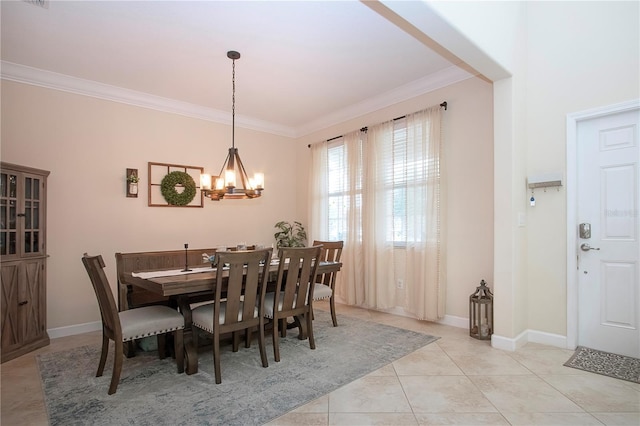 tiled dining space featuring an inviting chandelier and ornamental molding