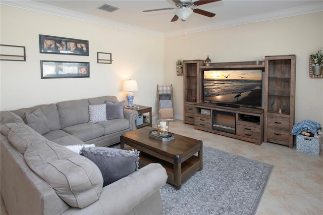 living room featuring crown molding, light tile patterned floors, and ceiling fan