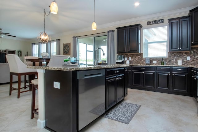 kitchen featuring hanging light fixtures, stainless steel dishwasher, a kitchen breakfast bar, and a center island