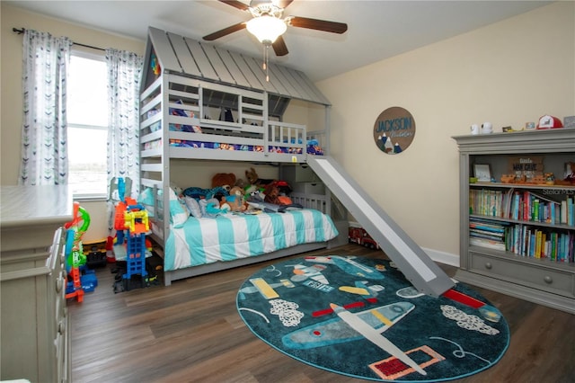 bedroom with dark wood-type flooring and ceiling fan