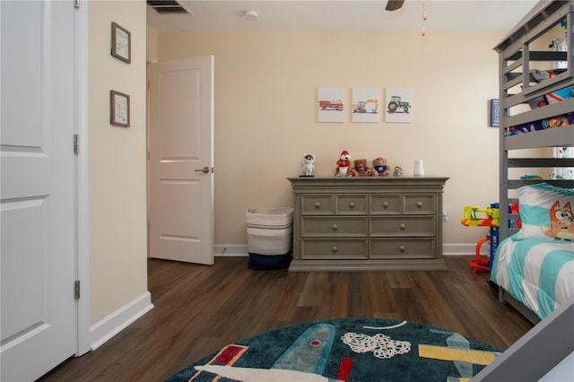 bedroom featuring dark wood-type flooring and ceiling fan