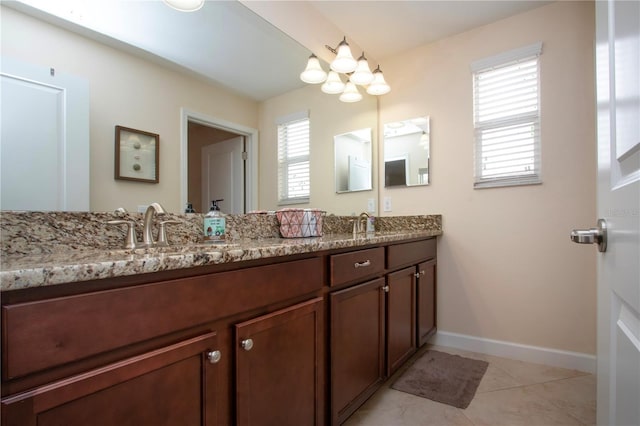 bathroom with tile patterned floors and vanity