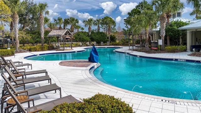 view of swimming pool with a gazebo and a patio area