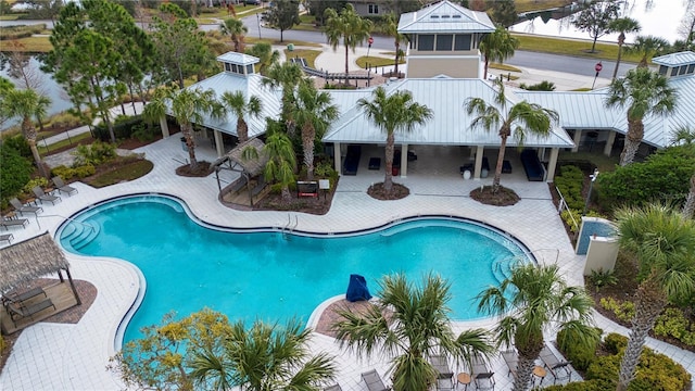 view of swimming pool with a patio area