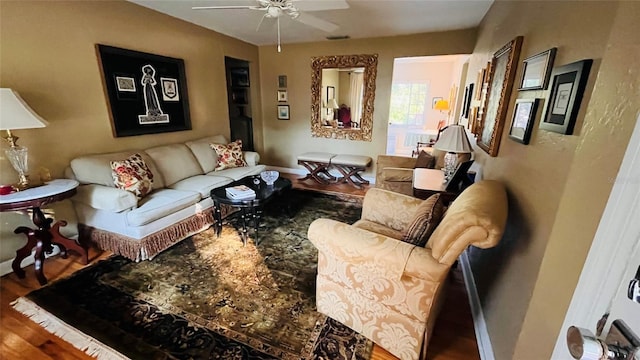 living room with hardwood / wood-style floors and ceiling fan