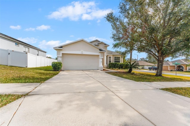 view of front facade featuring a garage and a front yard