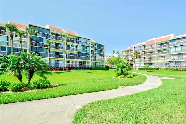 view of home's community with a lawn