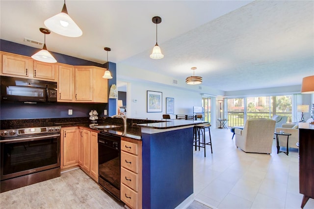 kitchen featuring decorative light fixtures, dark stone countertops, light brown cabinets, kitchen peninsula, and black appliances