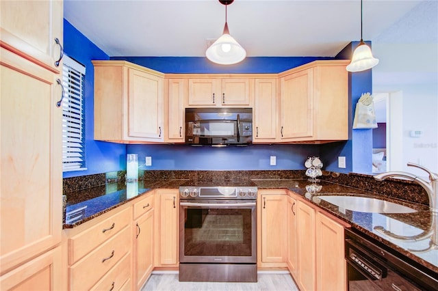 kitchen with decorative light fixtures, light brown cabinetry, sink, and black appliances