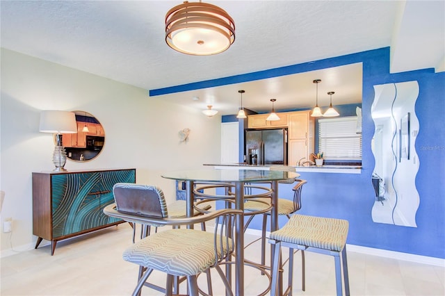 dining room featuring a textured ceiling