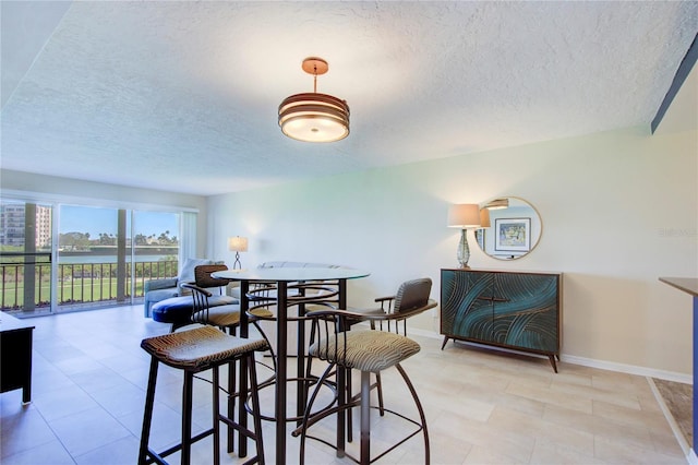 dining area with a textured ceiling