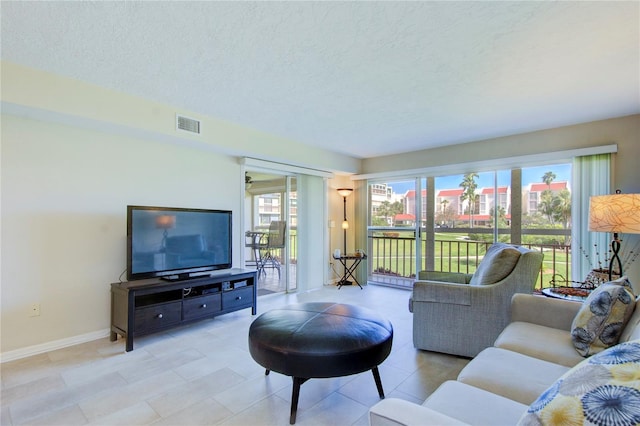 living room featuring a textured ceiling