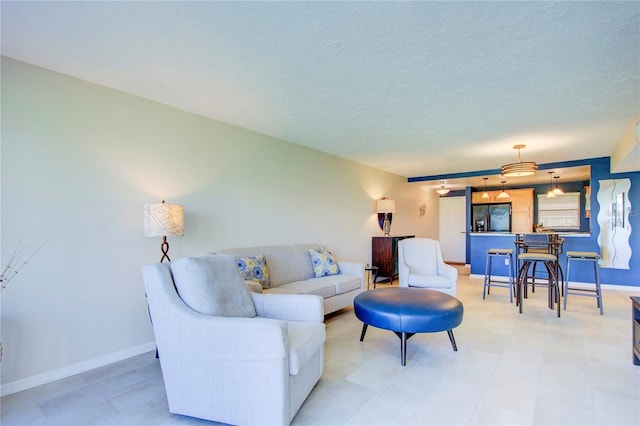 living room featuring a textured ceiling