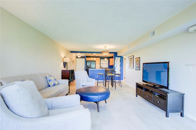 living room with a textured ceiling