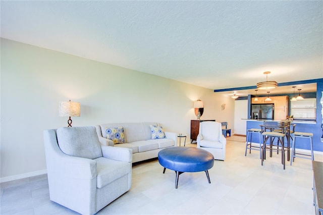 living room with a textured ceiling