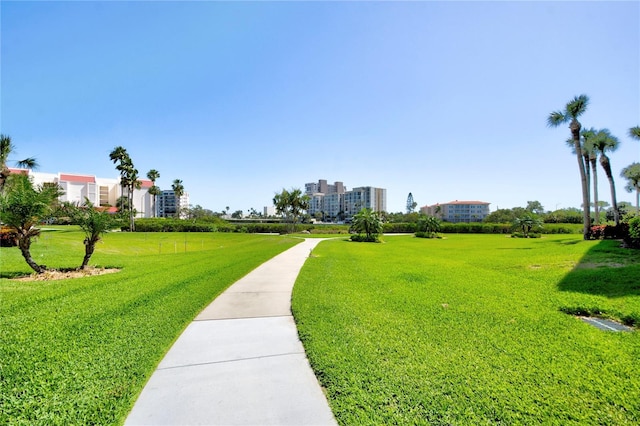 view of property's community with a lawn