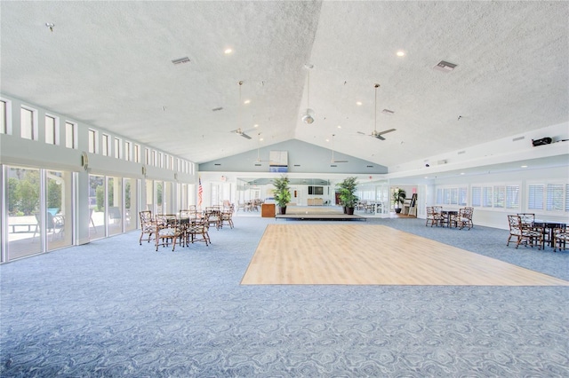 interior space featuring high vaulted ceiling and a textured ceiling