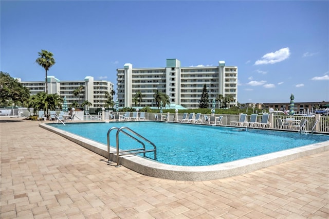 view of swimming pool with a patio