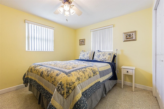 bedroom with light carpet and ceiling fan