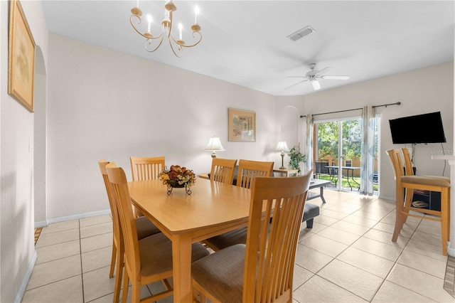 dining area featuring ceiling fan with notable chandelier and light tile patterned floors