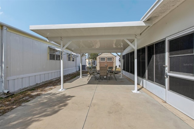 view of patio featuring a storage shed