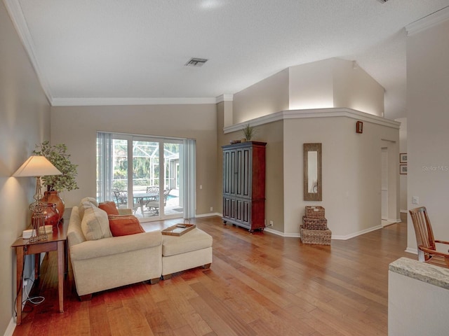 living room featuring crown molding and hardwood / wood-style floors