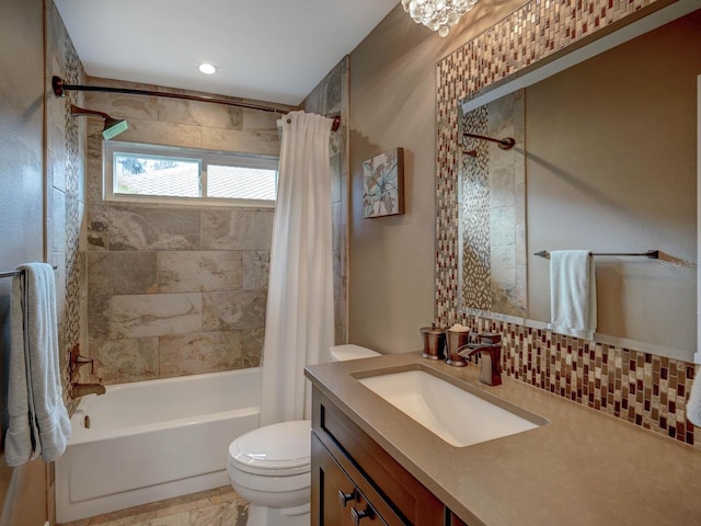 full bathroom with shower / tub combo with curtain, vanity, and toilet