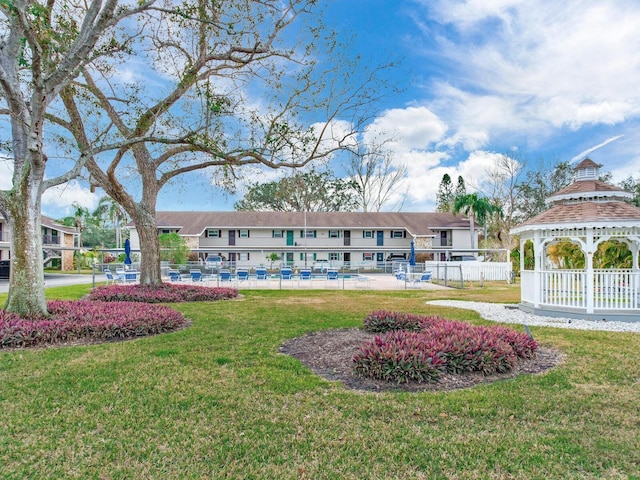 exterior space featuring a yard and a gazebo