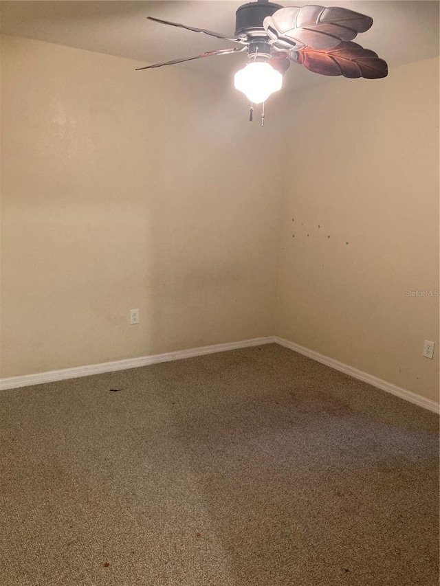 carpeted empty room with ceiling fan