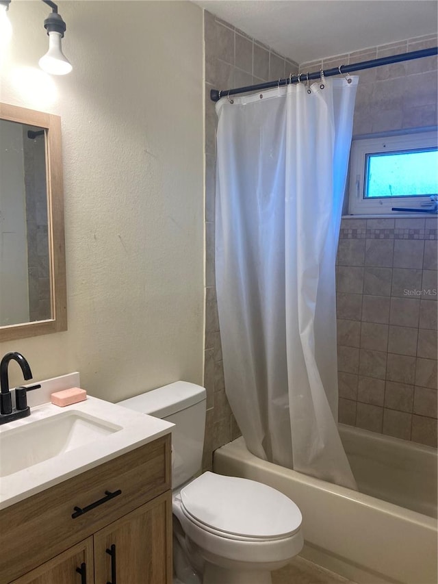 full bathroom with vanity, toilet, and shower / bath combo with shower curtain