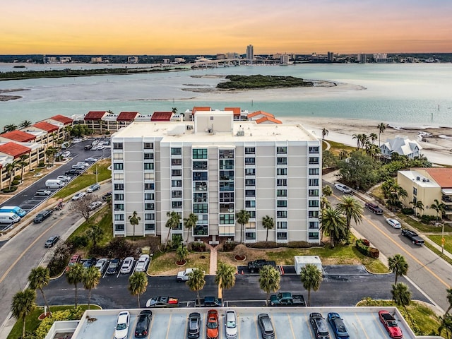 aerial view at dusk with a water view