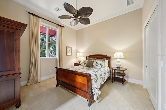 bedroom with light carpet, visible vents, and crown molding