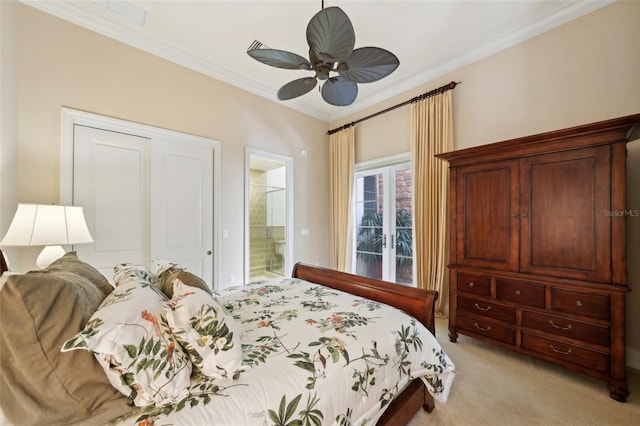 bedroom featuring a ceiling fan, light colored carpet, crown molding, and ensuite bathroom