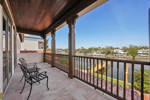 balcony featuring a water view