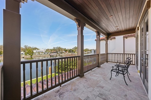 balcony featuring a water view